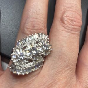 This is a 925 sterling silver ring with all clear stones. Selling as a Fashion